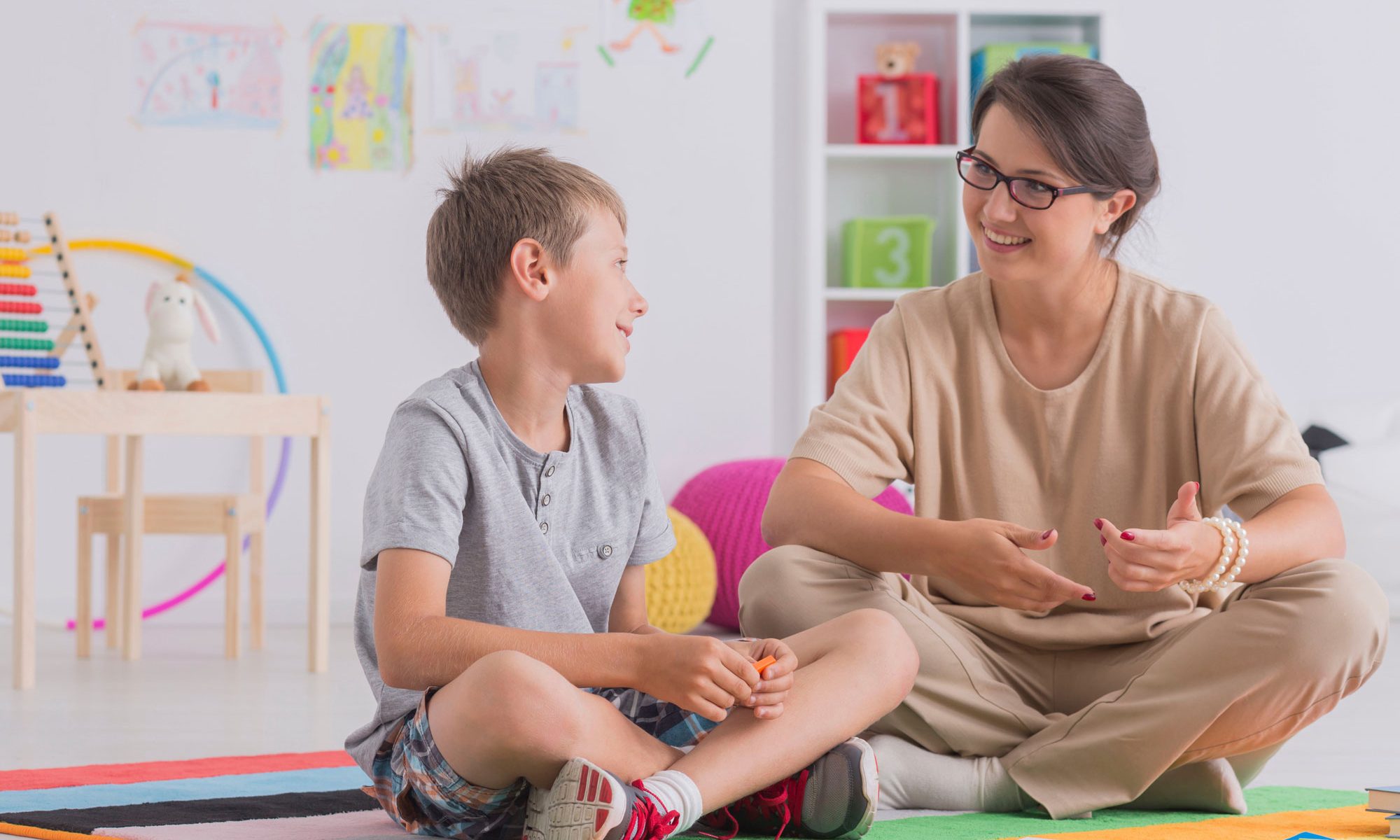 teacher-with-child-in-classroom